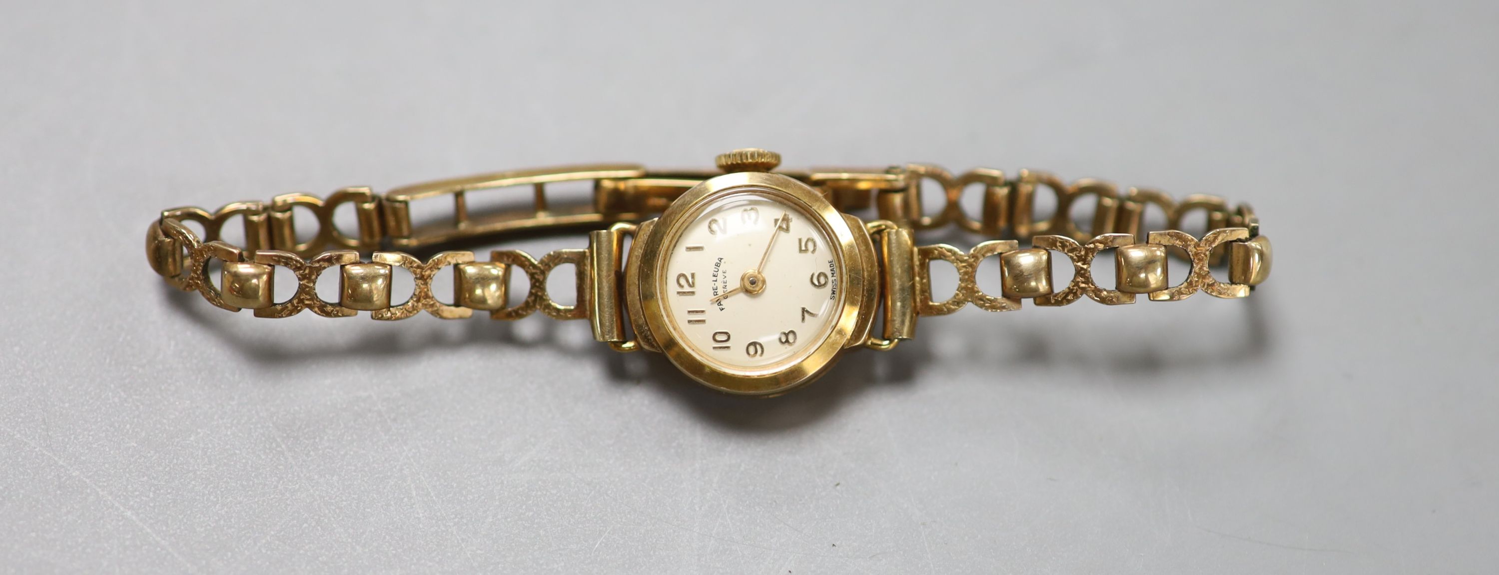 A lady's 9ct god Favre Leuba manual wind wrist watch, on a 9ct gold bracelet